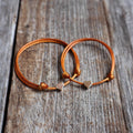 Mommy and me copper cord bracelets with 14k gold plated heart charm, adjustable matching set on wood