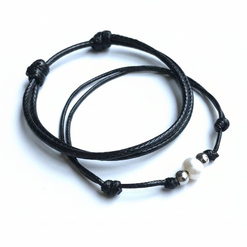 Gold accent pearl couple bracelets matching his and hers flat lay closeup