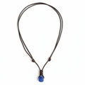 surfer necklace with a recycled blue sea glass bead