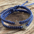 Two silver star charms navy blue macrame bracelets. The bracelets are knotted and have adjustable ties.
