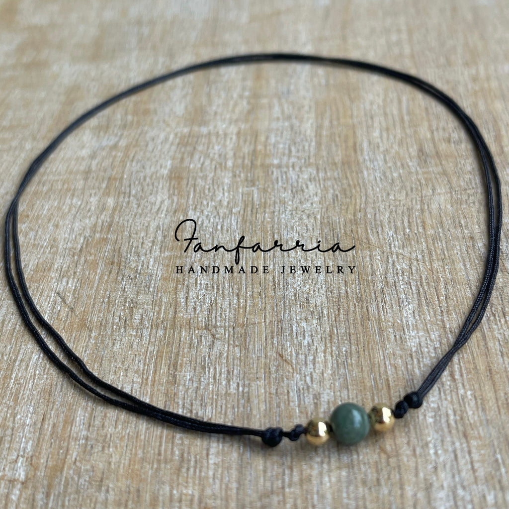Jade gemstone gold bead black choker necklace flat lay adjustable waterproof