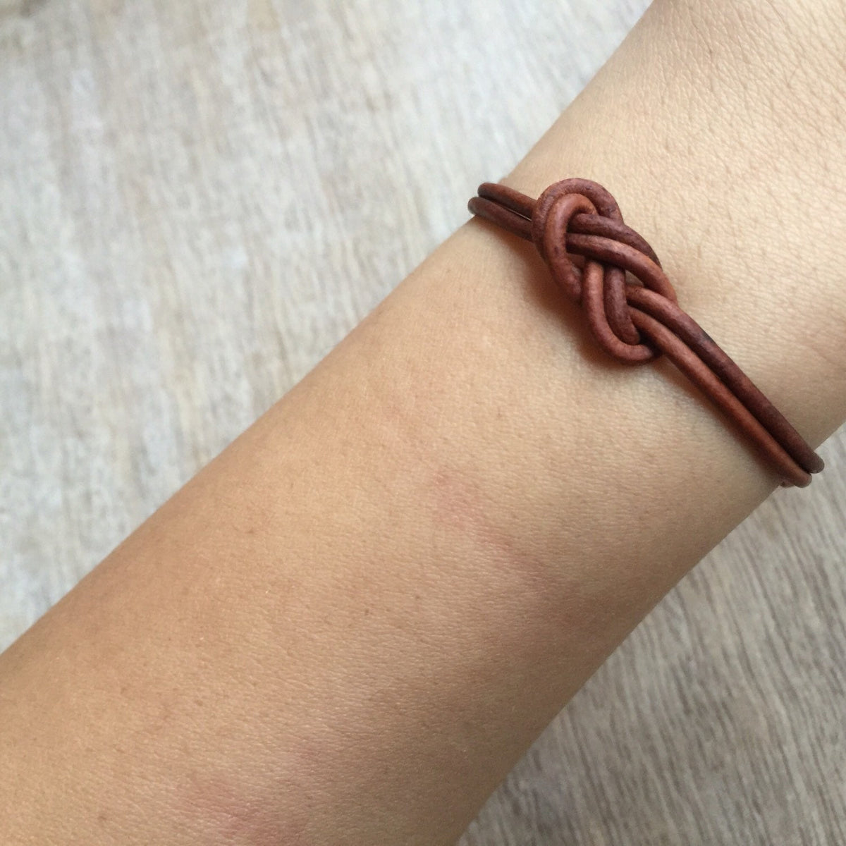 St Pete leather couple bracelets on wrist lifestyle photo his and hers